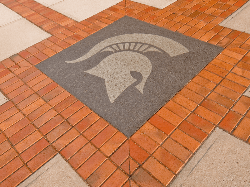 Spartan helmet in the brick on the ground in benefactor plaza
