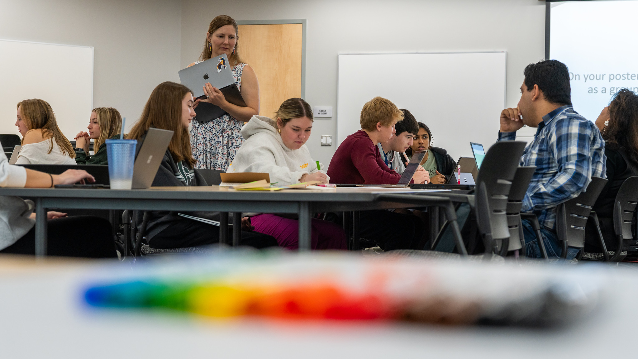 students studying at their desks in a classroom